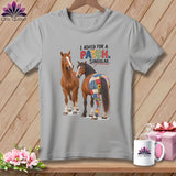 Two horses, one with a patchwork rear, on a gray t-shirt with text.
