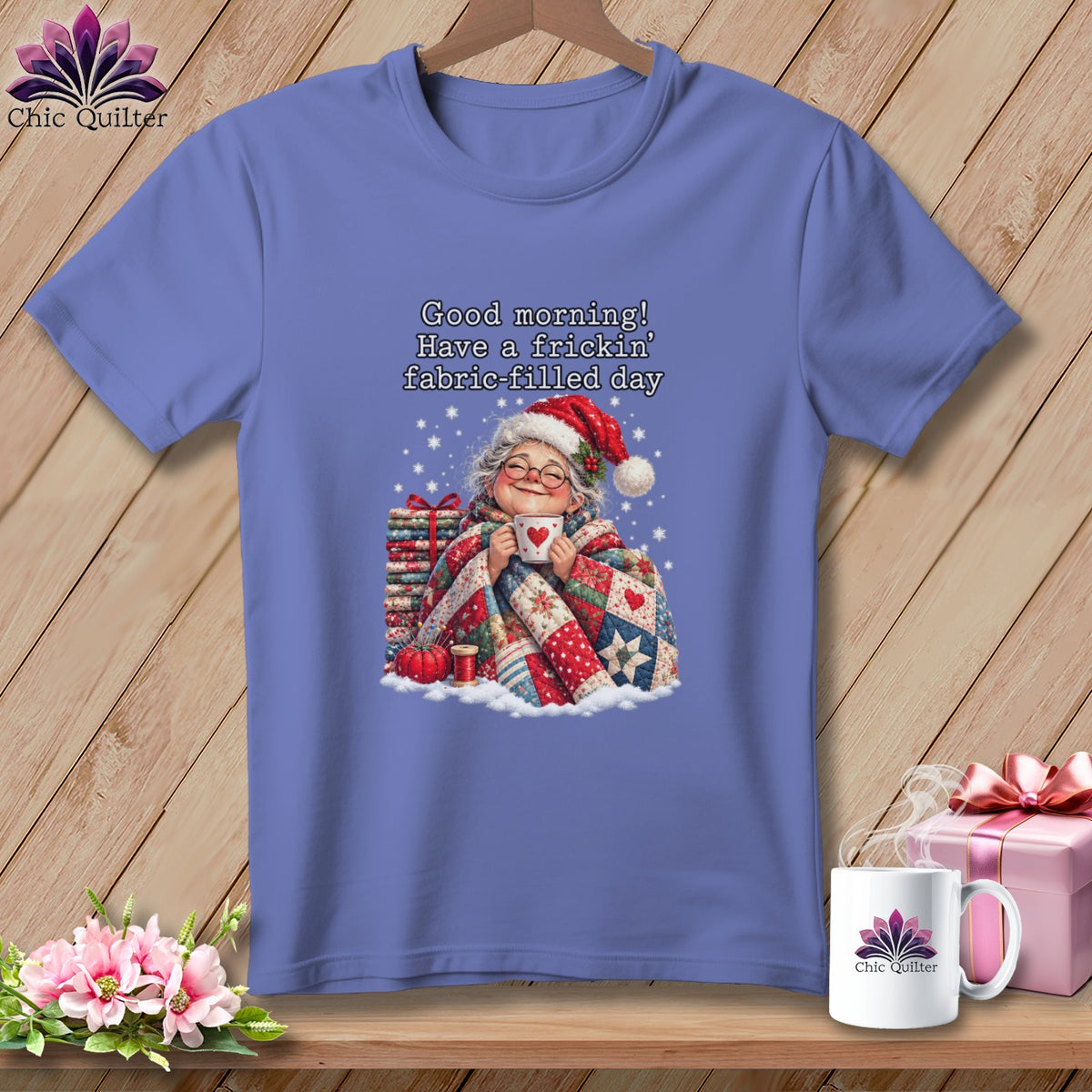 Periwinkle t-shirt featuring an elderly woman drinking from a mug with text reading Good morning! Have a frickin’ fabric-filled day.