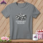 Grey t-shirt with graphic of folded quilt and "COMFORT MAKER" text.