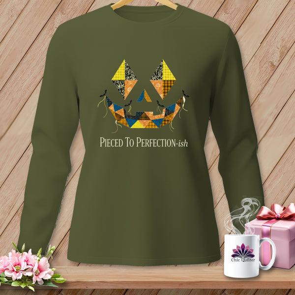 Green long-sleeve shirt with a patchwork jack-o'-lantern face design and text.