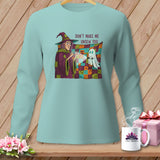 Witch holding a flashlight on a quilt with text 