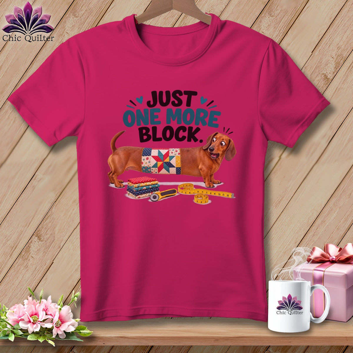 Dachshund wearing a quilt block with text "Just One More Block."