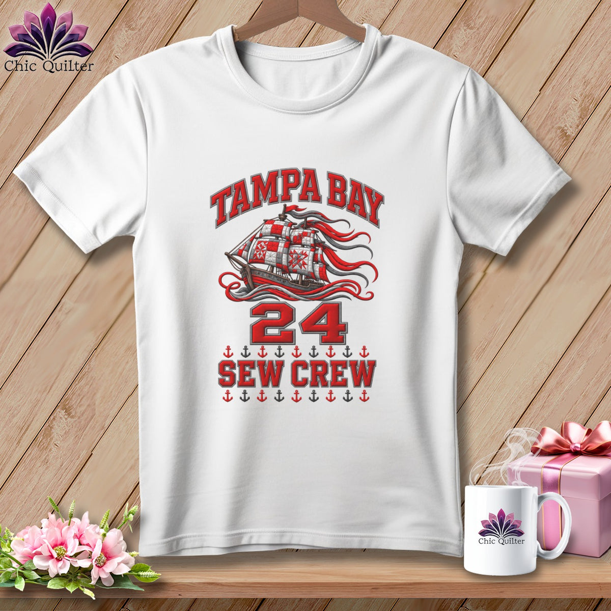 White t-shirt featuring Tampa Bay Sew Crew graphic with sailing ship, red text, and anchor motifs.