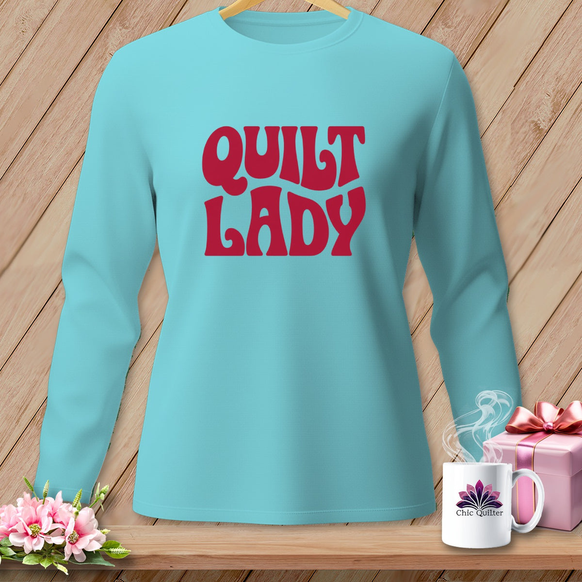 Teal long-sleeve shirt with "Quilt Lady" in red text.