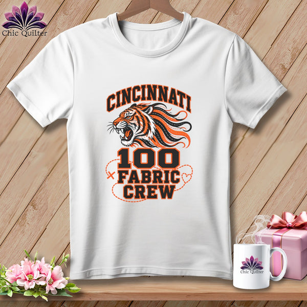 A white t-shirt features a Cincinnati tiger graphic with the text 100 Fabric Crew.