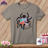 Gray t-shirt featuring a spider at a sewing machine with the text 