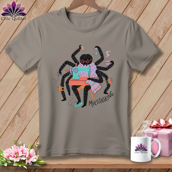 Gray t-shirt featuring a spider at a sewing machine with the text "MULTITASKING".