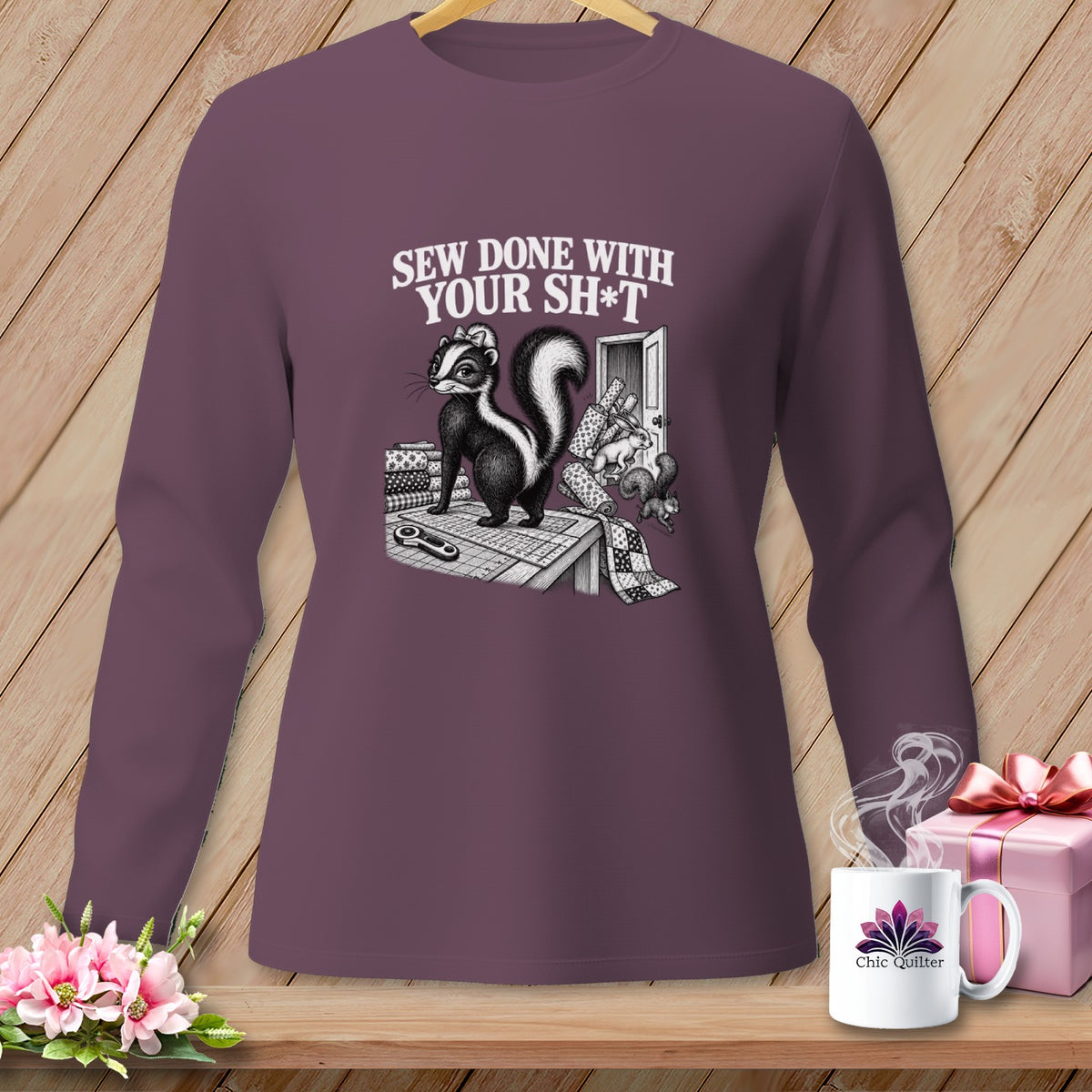 Skunk with sewing supplies and text "SEW DONE WITH YOUR SH*T".