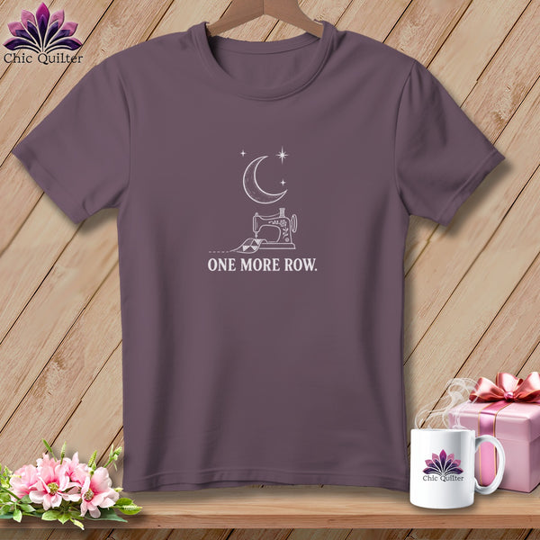 Purple t-shirt with white sewing machine, moon, stars, and text "ONE MORE ROW."