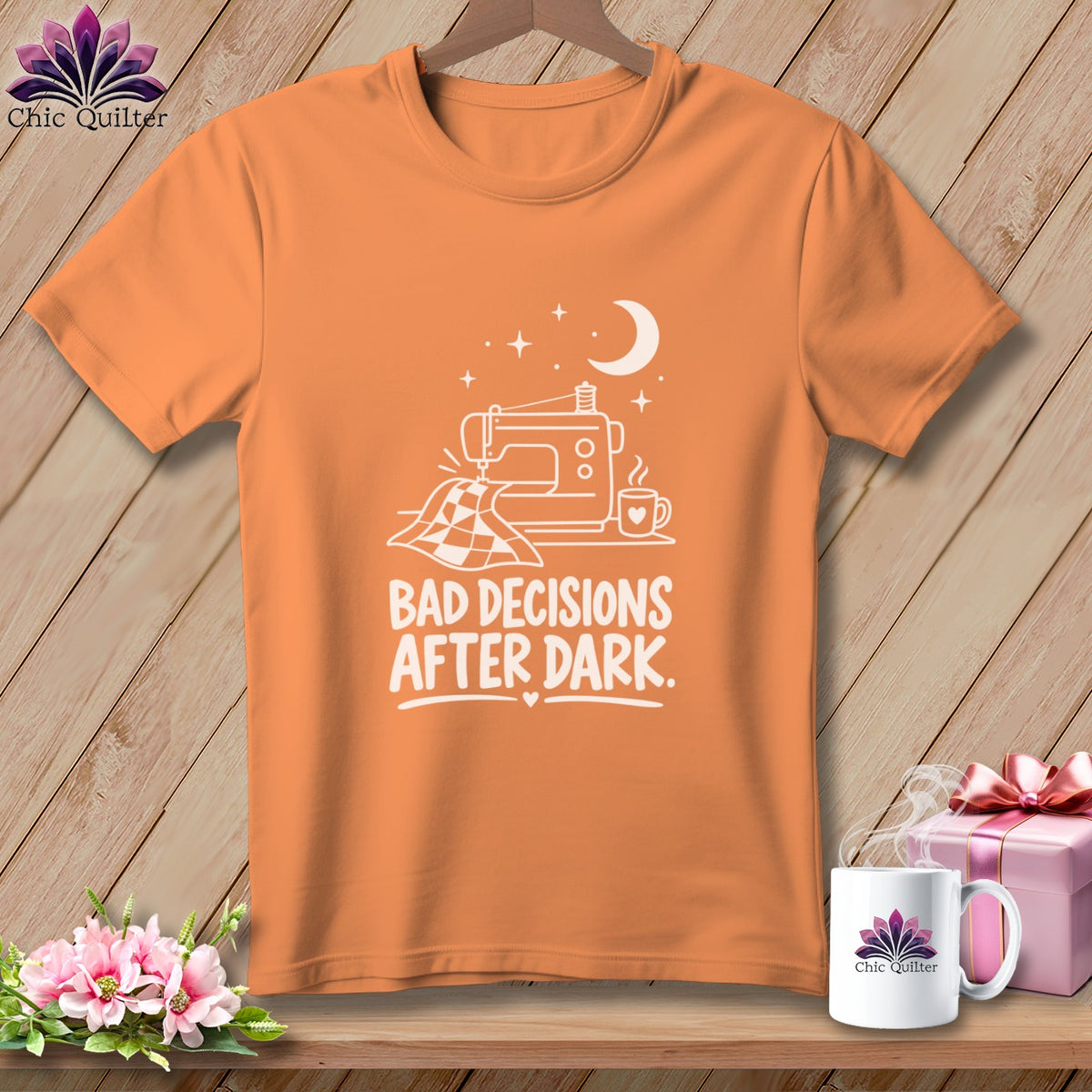 Orange t-shirt with sewing machine, quilt, moon, and text "Bad Decisions After Dark."