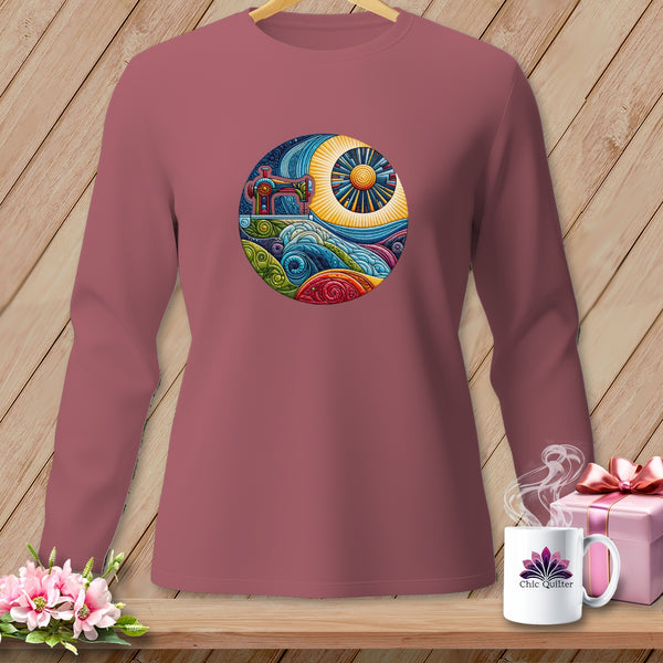 Long-sleeve shirt with circular sewing machine and sun graphic.