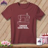 Maroon t-shirt with a white sewing machine graphic and the text 