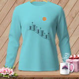 Turquoise long-sleeve shirt with sewing spool graphic and orange button.