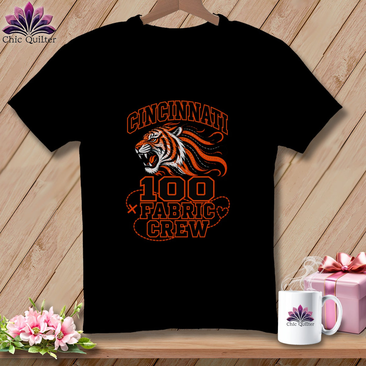 Black t-shirt featuring an orange tiger graphic with text reading Cincinnati 100 Fabric Crew.