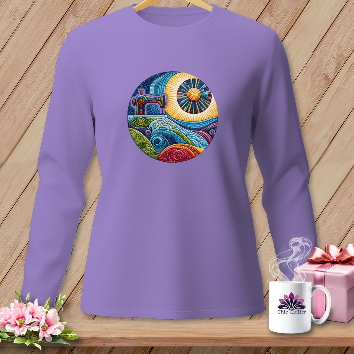 Lavender long-sleeve shirt with circular sewing machine and sun graphic.