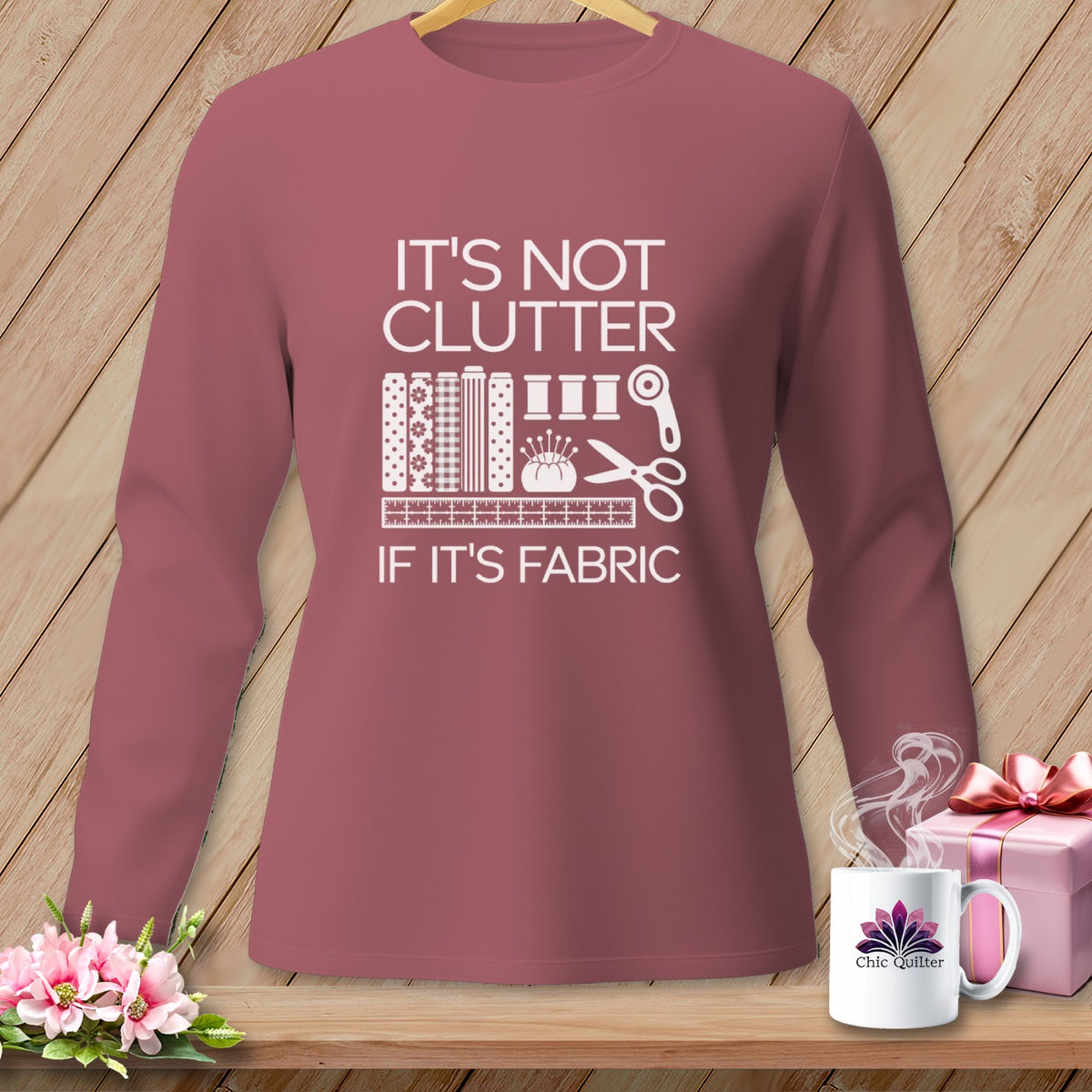 Mauve long-sleeve shirt with white text and sewing graphic.