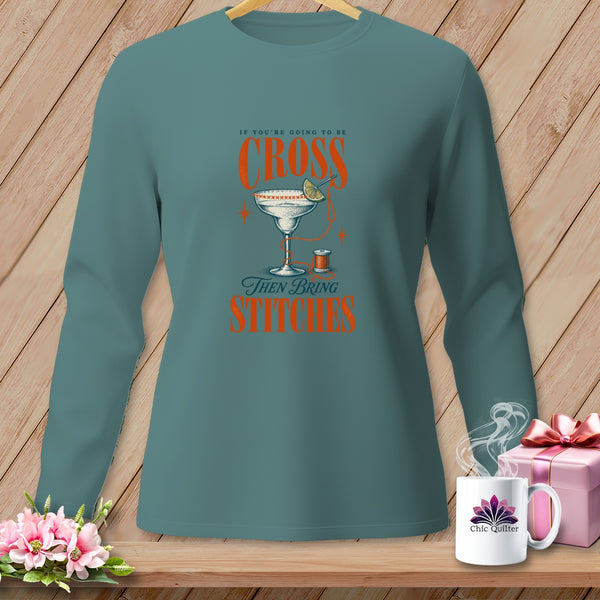 Teal long-sleeve shirt with "If You're Going to Be Cross Then Bring Stitches" text.