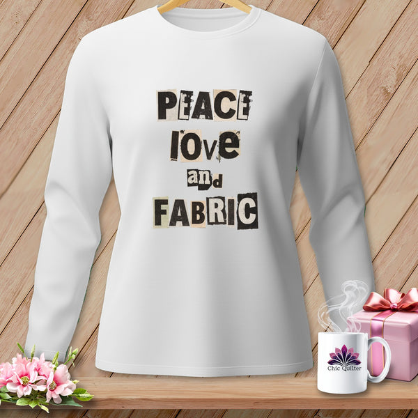 White long-sleeve shirt with "Peace Love and Fabric" text.
