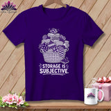 Purple t-shirt with white graphic of fabric rolls in a basket and 