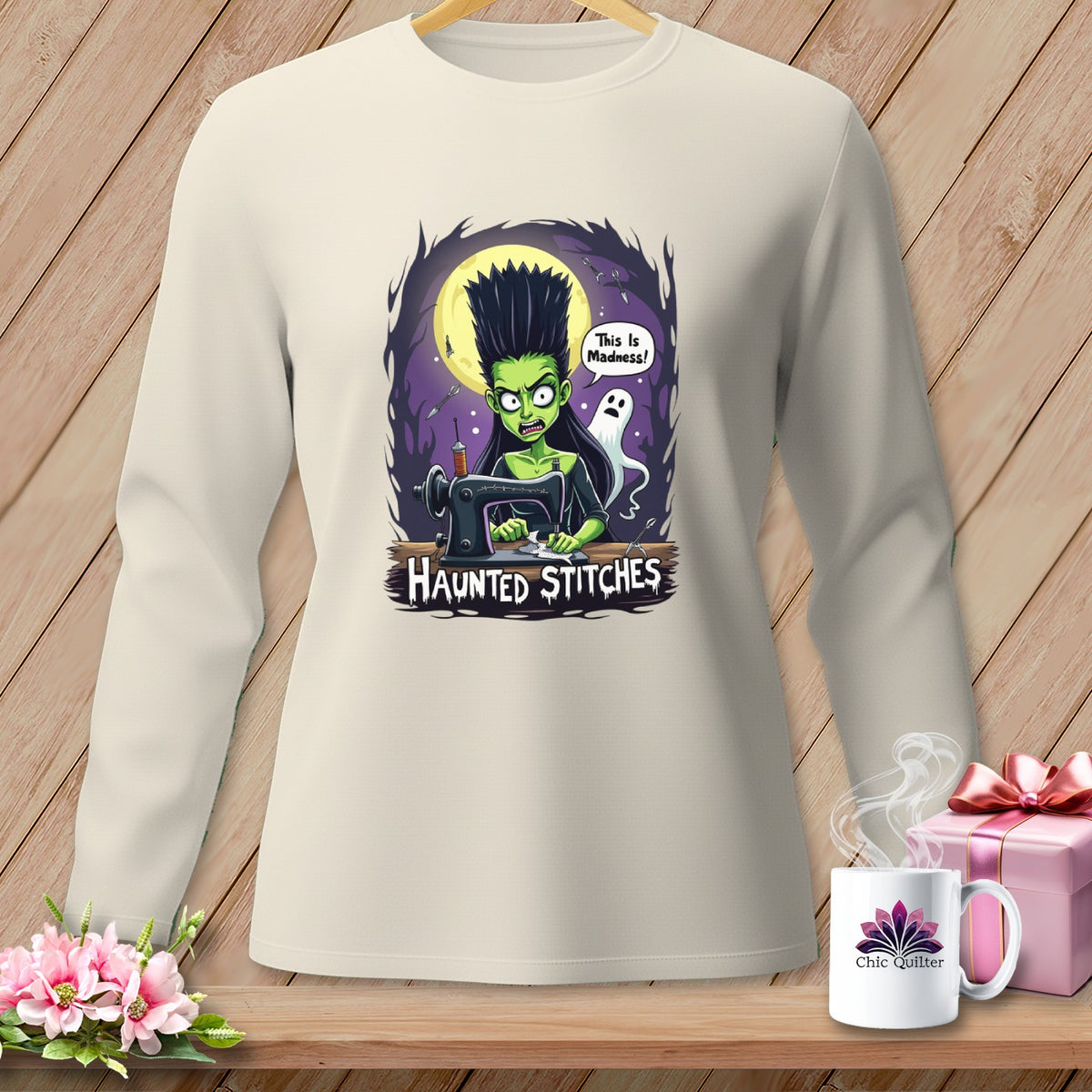 Crewneck long-sleeve shirt with a "Haunted Stitches" graphic of a green witch at a sewing machine.