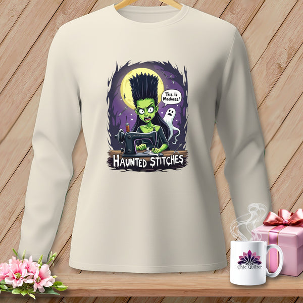 Crewneck long-sleeve shirt with a "Haunted Stitches" graphic of a green witch at a sewing machine.