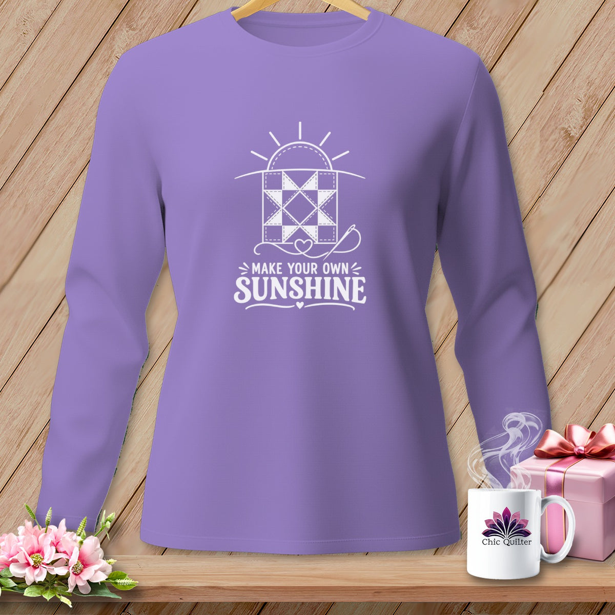 Purple long-sleeve shirt with white "Make Your Own Sunshine" quilt graphic.