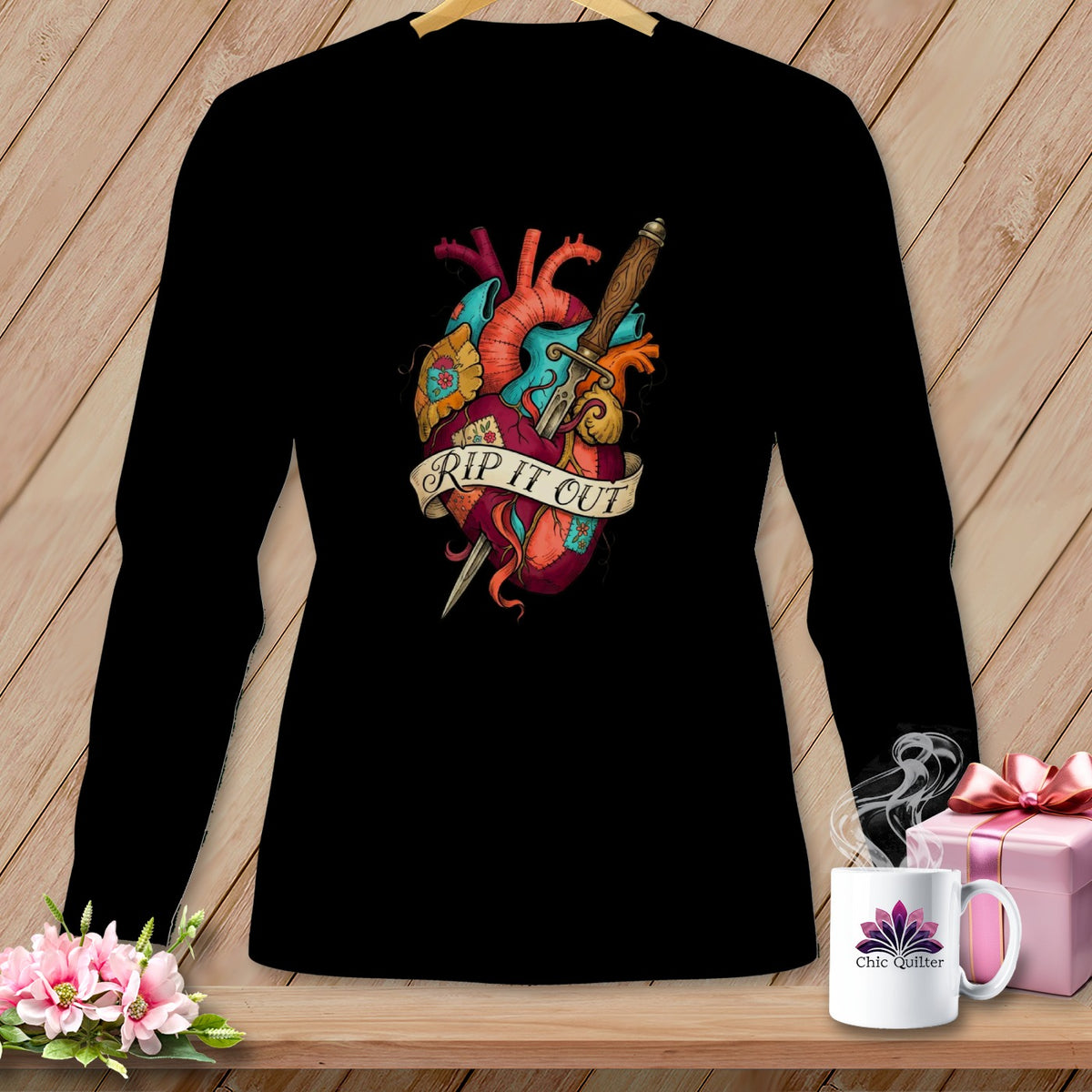 Black long-sleeve shirt with anatomical heart and dagger design reading "RIP IT OUT".