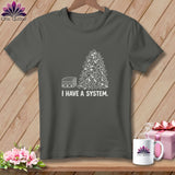 Dark grey t-shirt with white graphic of stacked fabric and scraps, reads 
