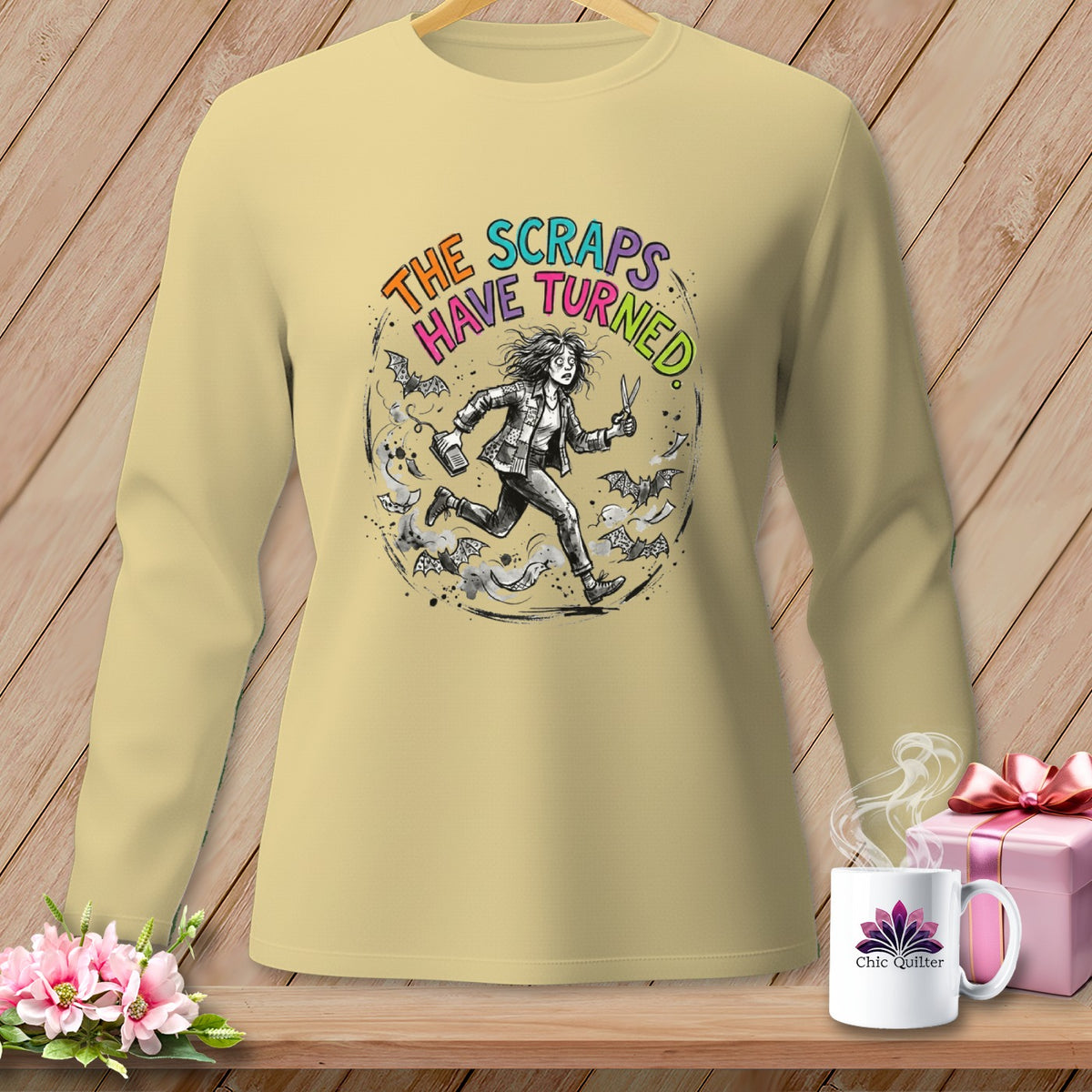 Light yellow long sleeve shirt with "THE SCRAPS HAVE TURNED" text and a running figure.