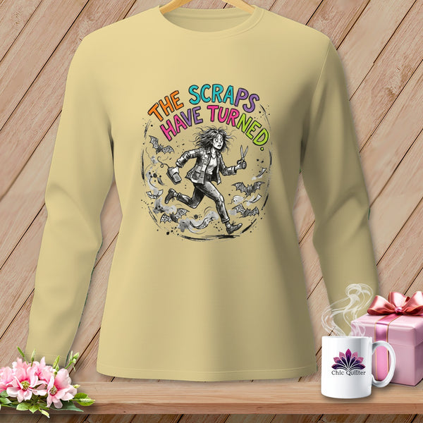 Light yellow long sleeve shirt with "THE SCRAPS HAVE TURNED" text and a running figure.