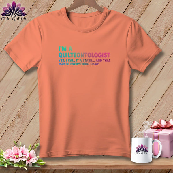 Peach t-shirt with "I'm a Quilteontologist" text and gift box.