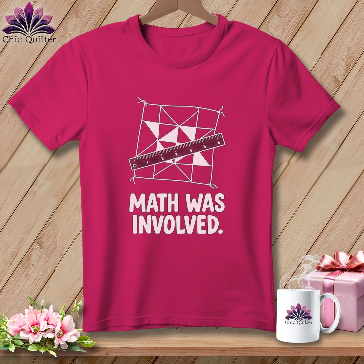 Pink t-shirt with a quilt pattern, ruler, and text "MATH WAS INVOLVED."