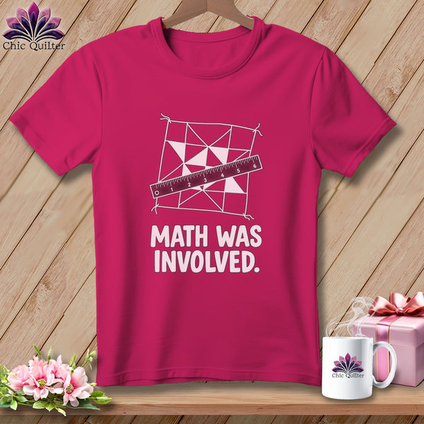 Pink t-shirt with a quilt pattern, ruler, and text "MATH WAS INVOLVED."