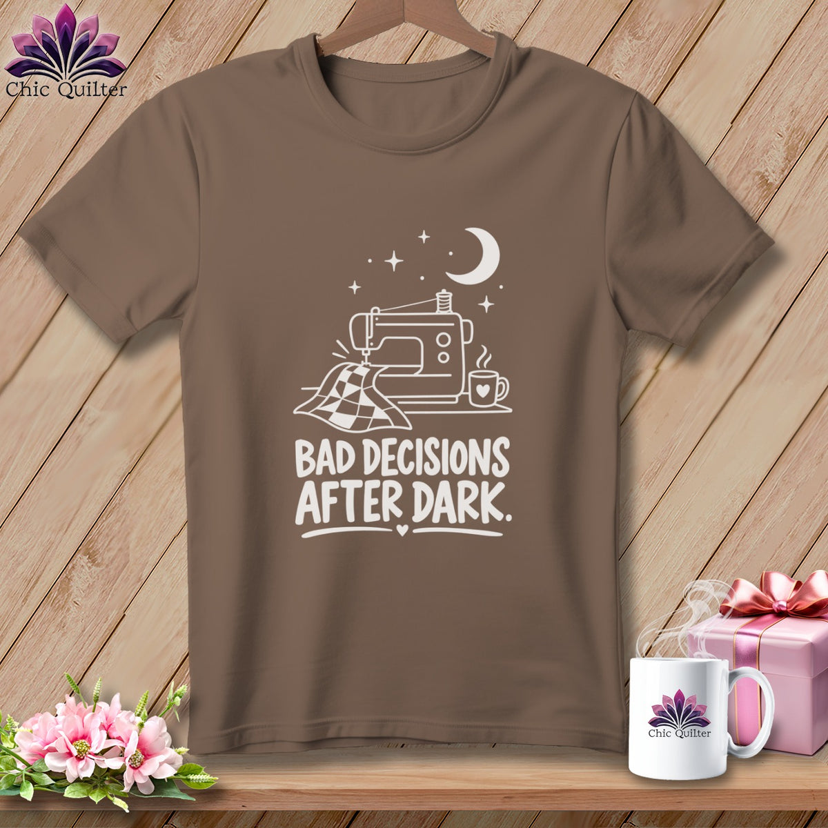 Brown t-shirt with white graphic of a sewing machine, quilt, coffee, moon and stars, and text.