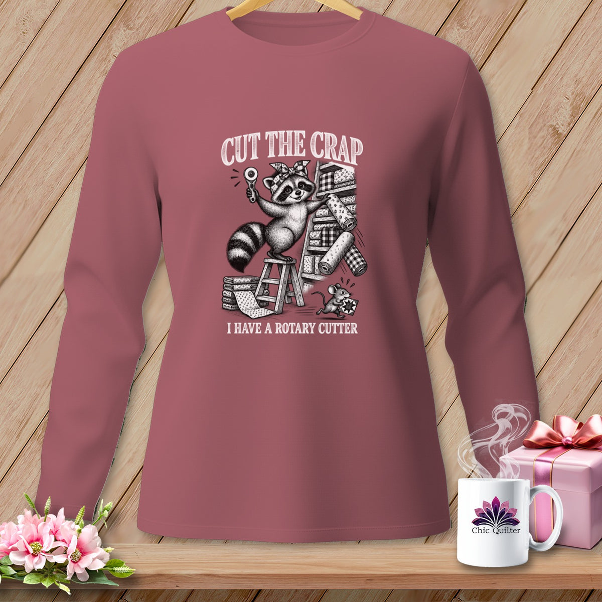 Long sleeve shirt with a raccoon holding a rotary cutter and the text "CUT THE CRAP I HAVE A ROTARY CUTTER."