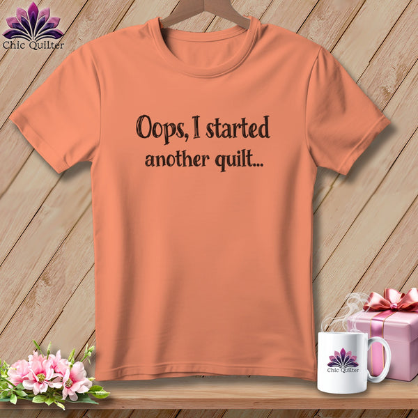 Coral t-shirt with "Oops, I started another quilt..." text.