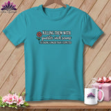 Teal t-shirt hanging on a wooden background with quilting text, a mug, and a gift box.
