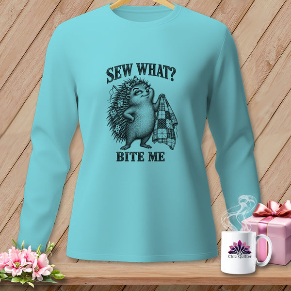 A light blue long-sleeved shirt featuring a graphic of a hedgehog holding a quilt with text reading SEW WHAT BITE ME.