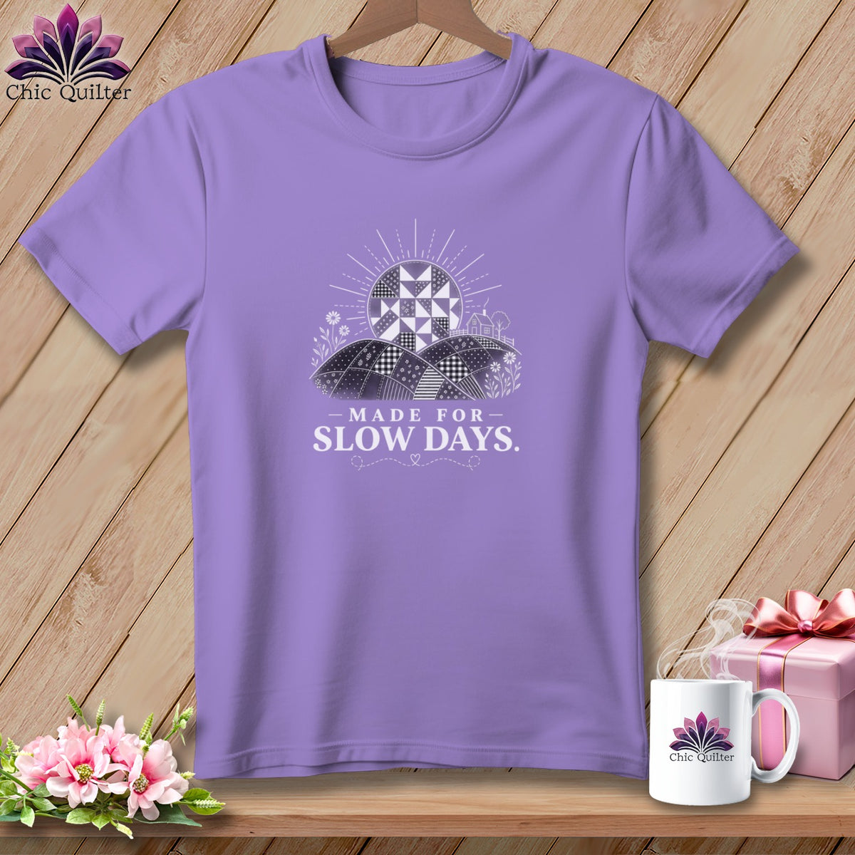 Purple t-shirt with "Made for Slow Days" text and quilt-inspired landscape.