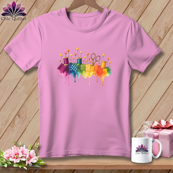 Pink t-shirt with watercolor sewing supplies graphic and "Chic Quilter" logo.