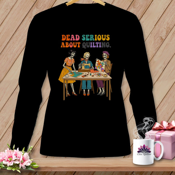 Skeleton quilters with text "Dead Serious About Quilting" on a black long-sleeve shirt.