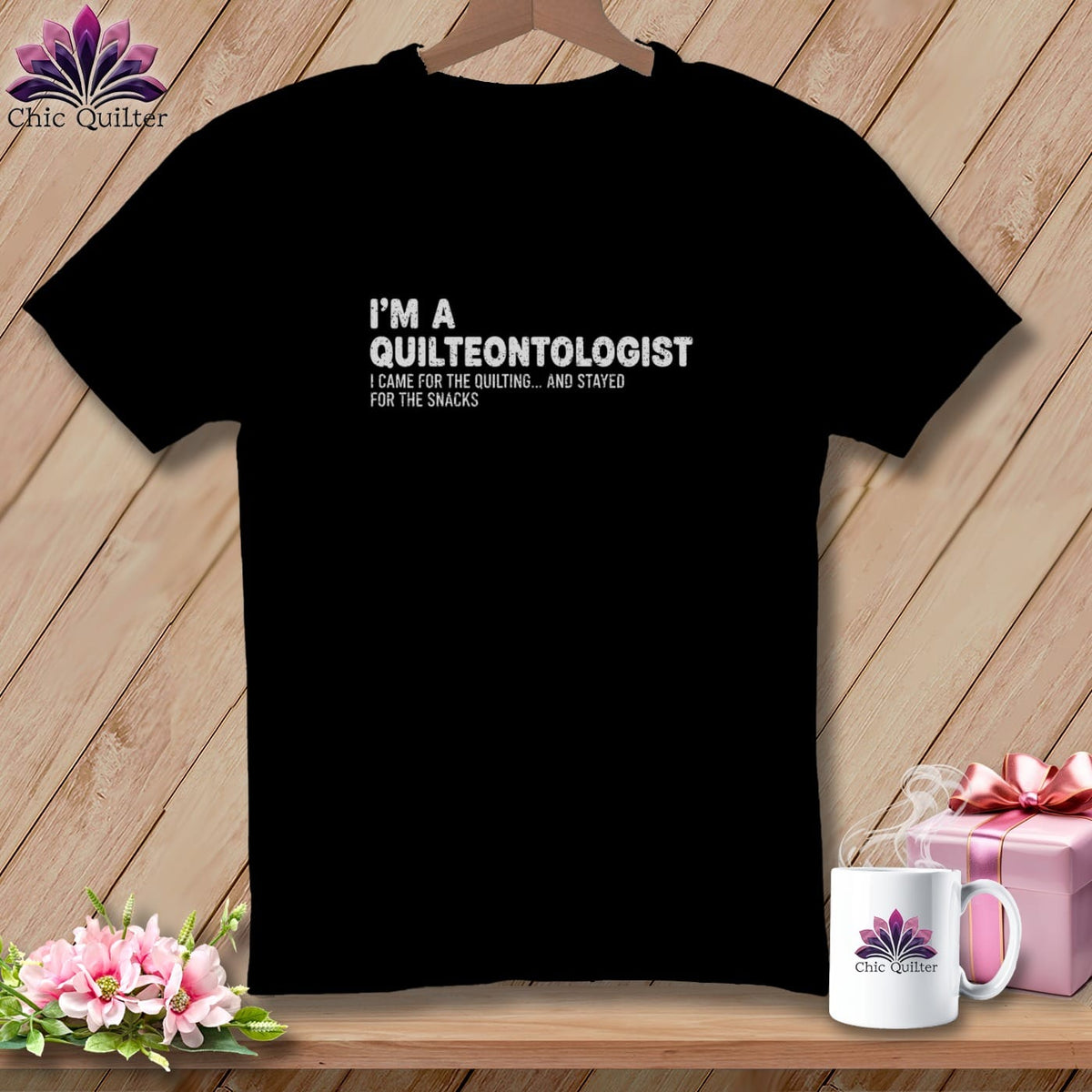 Black t-shirt with "I'm a Quilteontologist" and quilting/snacks quote.