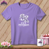 Purple t-shirt with rotary cutter, quilt pattern, and 